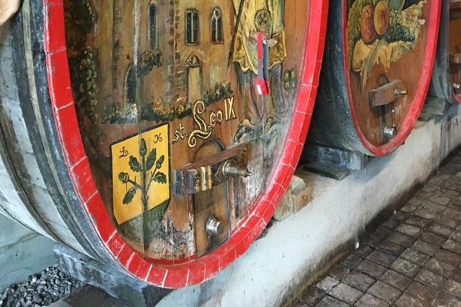 The carved and painted heads of two old casks in a cellar