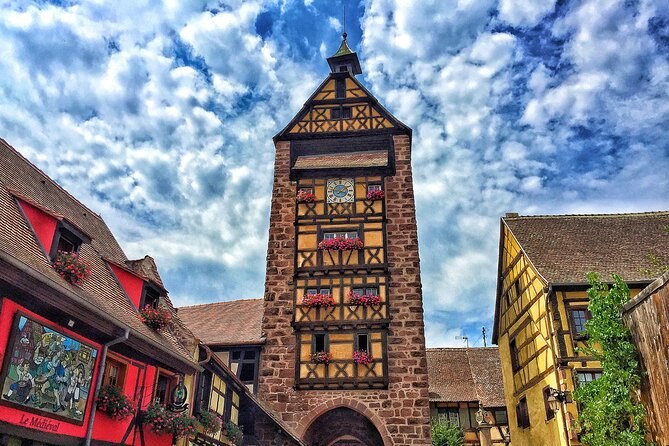 A painted half-timbered gate tower closing the end of a village street