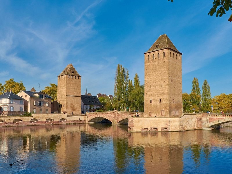The square watchtowers of Strasbourg's Ponts Couverts across the river
